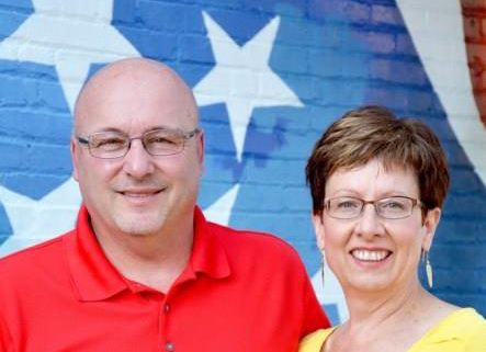 Earnie and Kelly Zimmerman smiling at the camera