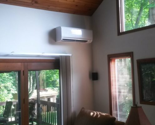 picture of a mini split system mounted on a wall in a living room