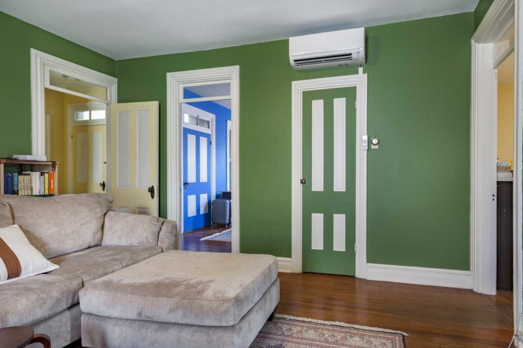 Indoor wall-mount ductless air handler installed in a living room