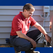 a man in a zimmerman hvac shirt is working on a lennox air conditioner