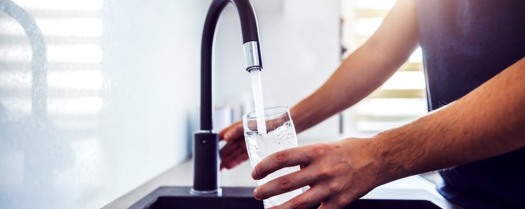 Filling glass of water