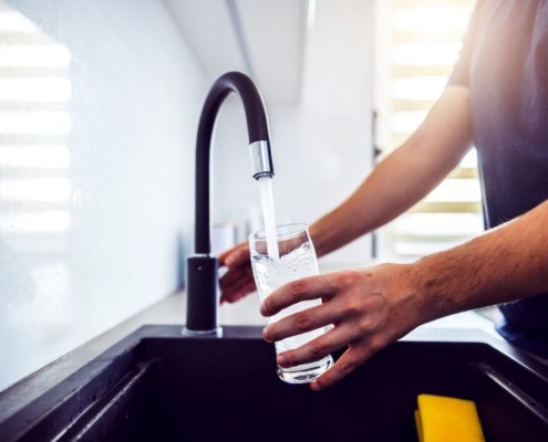 Filling glass of water