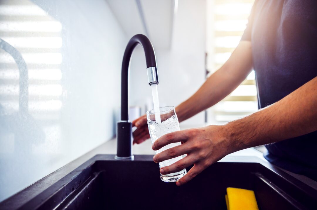Filling glass of water